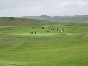 crowd watching ulster senior golf tournament