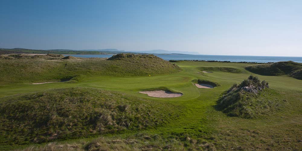 hole 10 of donegal golf course green field against blue sky