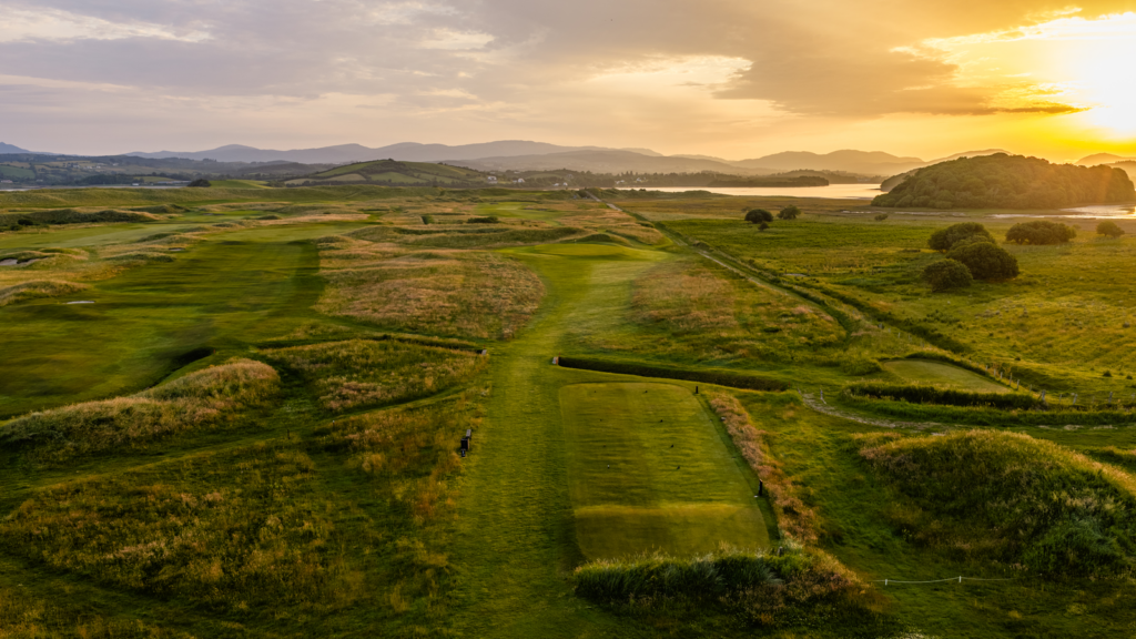 aerial view of the golf course with natural green and coastal scenery