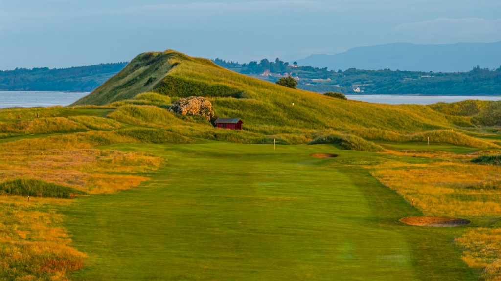 grass hill featuring a small red bunker on a sunny day in donegal